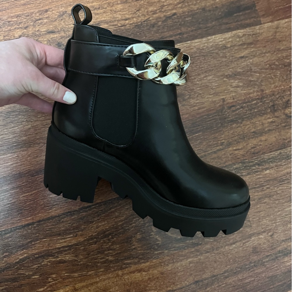 Black boots with gold chain detail